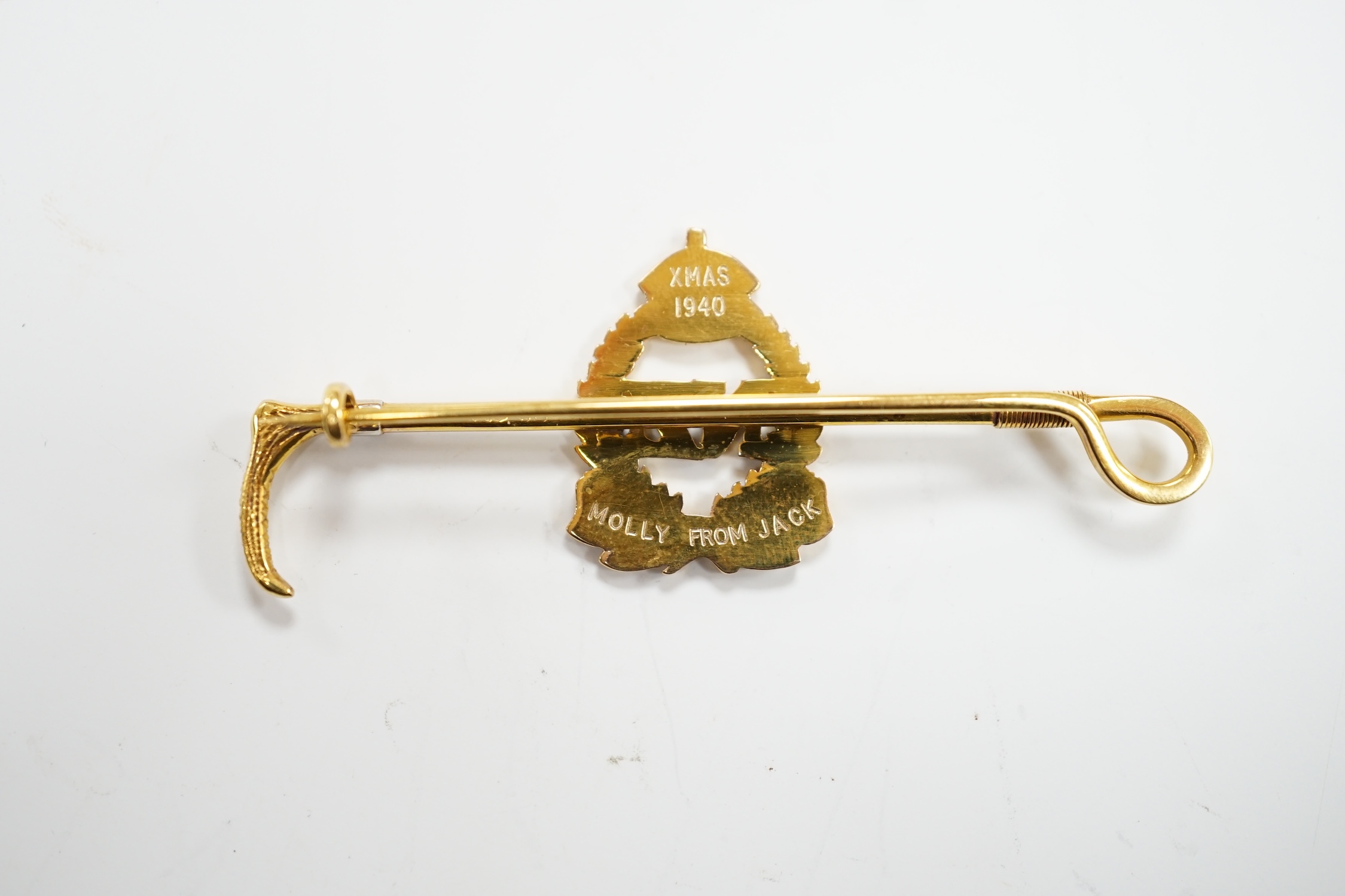A 1940's 9ct, plat. and two colour enamel set New Zealand Infantry and riding crop sweethearts bar brooch, with engraved inscription, 65mm